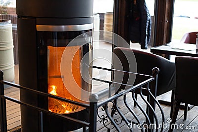 Restaurant fireplace in Kaliningrad. Metal fence Stock Photo