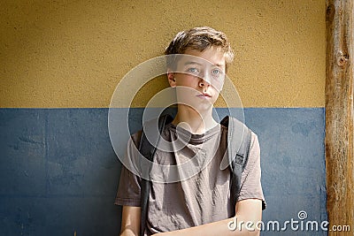 Sitting sad teenage boy Stock Photo