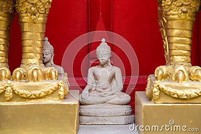 Sitting white Buddha statue mistake in create at temple Thailand Stock Photo