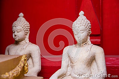 Sitting white Buddha statue mistake in create at temple Thailand Stock Photo