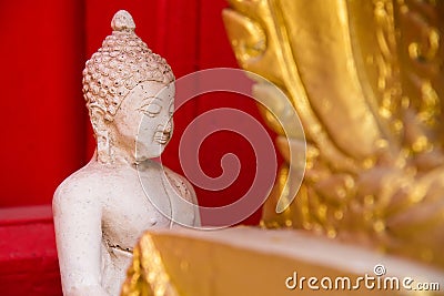 Sitting white Buddha statue mistake in create at temple Thailand Stock Photo