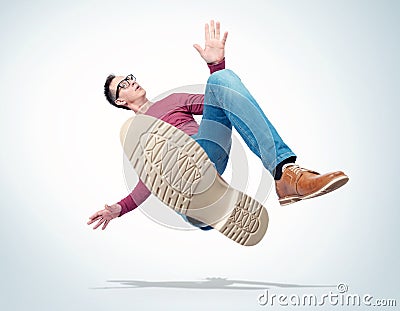 Situation, the man in casual clothes and glasses is falling down. Concept of an accident Stock Photo