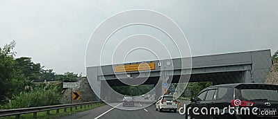 The situation on the toll road ahead of passing the alley under the elevated toll road Editorial Stock Photo