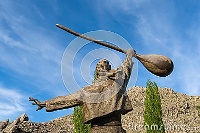 Sivrihisar, Eskisehir, Turkey - May 8 2022: Back view of sculpture of man hold a baglama which is a Turkish folk music instrument Editorial Stock Photo