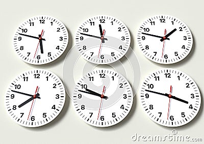 Six analog clocks on wall, showing world time Stock Photo