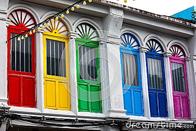 Six colorful doors or windows outside on the facade of an ancient house Stock Photo