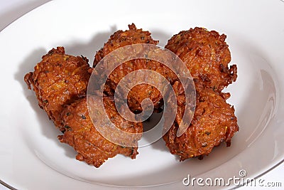 Six large Indian onion bhajis from an Indian restaurant. Stock Photo