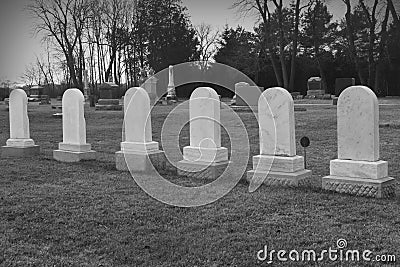 Six Matching Tombstones in Cemetary Stock Photo