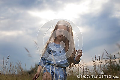 Horizontal photo of a six year old girl with long hair Stock Photo