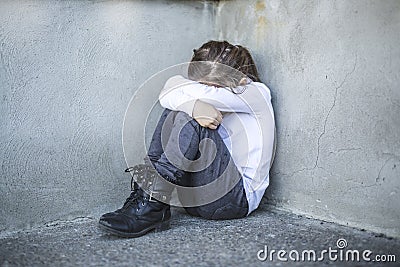 Six years old school girl to the schoolyards Stock Photo