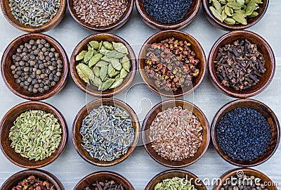 Sixteen Bowls of Spices Stock Photo