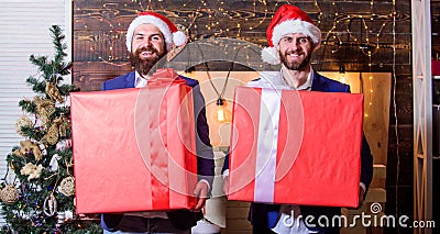 Size matters. Men santa carry big gift boxes. Biggest gift for christmas. Big wrapped box with ribbon. Great surprise Stock Photo