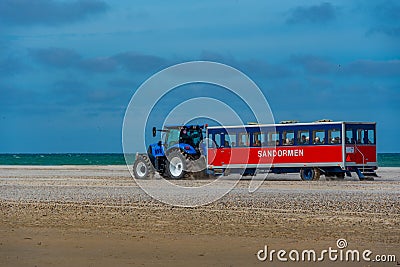 Skagen, Denmark, June 15, 2022: Tractor carrying tourists at Gre Editorial Stock Photo