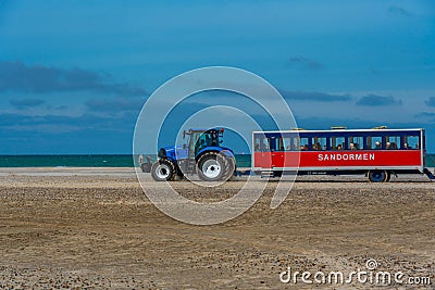 Skagen, Denmark, June 15, 2022: Tractor carrying tourists at Gre Editorial Stock Photo