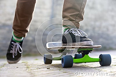 Skateboarder departing Stock Photo