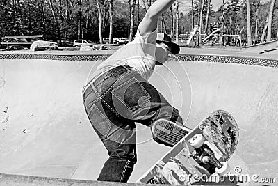 Skateboarder Skating a Bowl Stock Photo