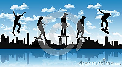 Skateboarders with a city silhouette Stock Photo