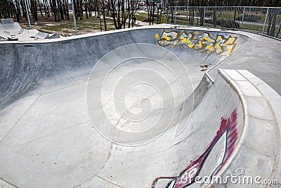 Skatepark made of concrete with graffiti Editorial Stock Photo