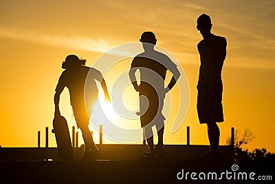 Skater friends at skate park on summer day Stock Photo