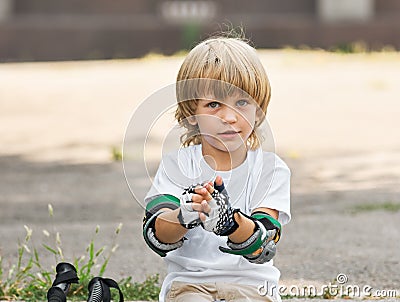 Skater taking off gloves Stock Photo