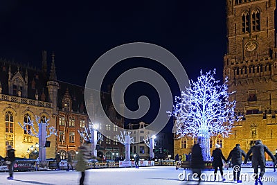 Skaters at Christmas in Grote Markt with Belfort Editorial Stock Photo