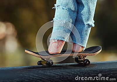 Skating on the fingerboard, training process Stock Photo