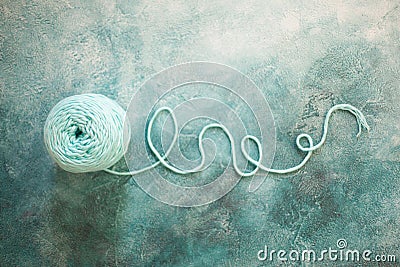 Skein of yarn for knitting mint color. Aquamarine background Stock Photo