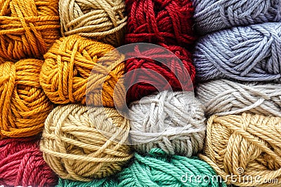 Skeins of colourful yarn arranged in raws Stock Photo