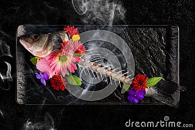 Skelet of fish with flowers and smoke Stock Photo