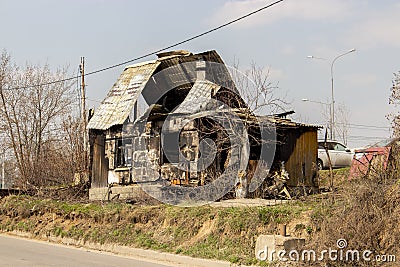 The skeleton of a burnt wooden house, a residential building after a fire, without treatment Stock Photo