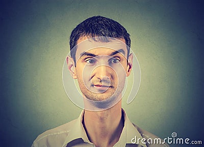 Skeptic man with discontent on his face Stock Photo