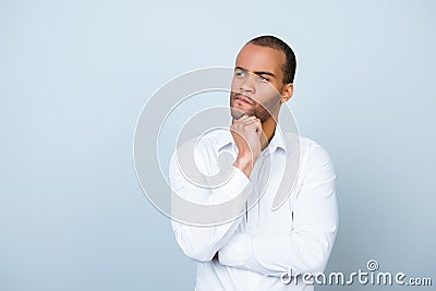 Skeptic, unsure, uncertain, doubts concept. Young african guy in Stock Photo