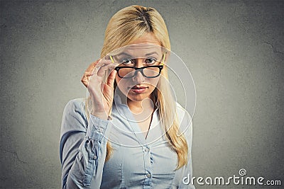 Skeptic woman doubtful looking at you Stock Photo