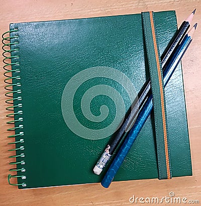 A sketchbook with a pair of drawing pencils Stock Photo