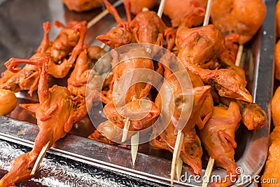 Skewered deep fried One day old chicks, an exotic Filipino street food Stock Photo