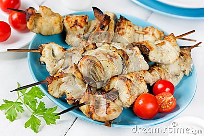 Skewered fish with vegetables Stock Photo