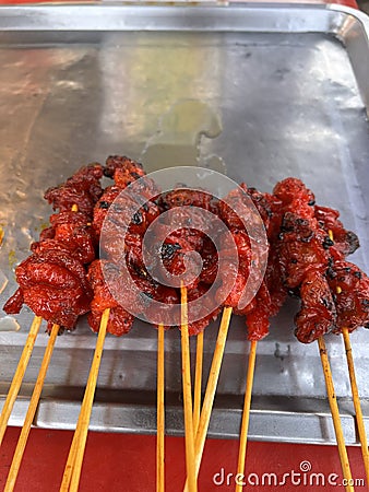 Skewered grilled chicken is sold on the local streets of Thailand Stock Photo