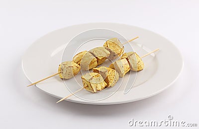 Skewers curry tandoori Chicken tikka kebabs on white background Stock Photo