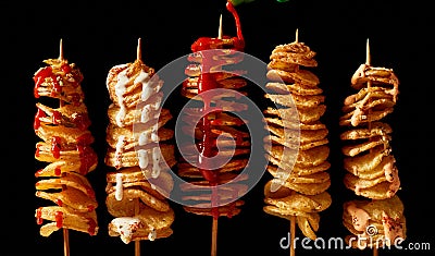 Skewers with fried potatoes and sauces Stock Photo