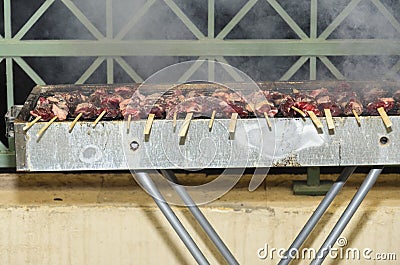 Skewers of meat on the grill Stock Photo