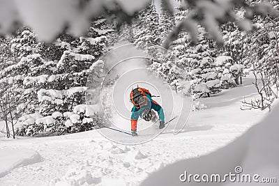 Ski accident with rider falling in forest Stock Photo