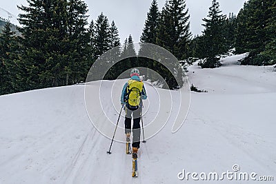 Ski alpinist training in the snowy Austrian Alps with equipment during the daytime Editorial Stock Photo