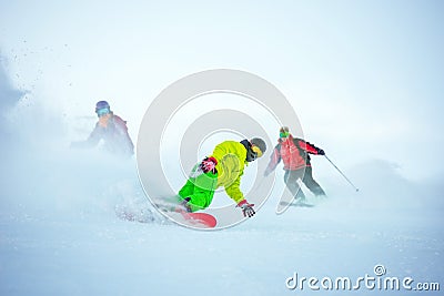 Ski downhill concept with group of snowboarders Stock Photo