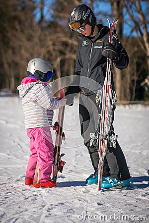 Ski instructor and little girl Editorial Stock Photo