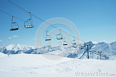 Ski lift chairs on bright day Stock Photo