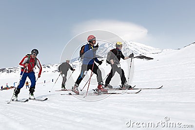 Ski mountaineers climb on skis on mountain. Team Race ski mountaineering. Russia, Kamchatka Editorial Stock Photo