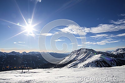 Ski resort.Ski slopes.Sunny day at the ski resort.Panoramic view on snowy off piste slope for freeriding with traces from skis, sn Stock Photo