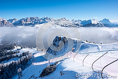 A ski slope above clouds, Alta Badia, Italy Stock Photo