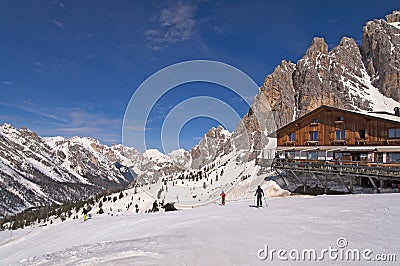 Ski slope and hut in Dolomites, Italy Stock Photo