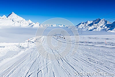 Ski slope in the mountains. Sunny winter landscape Stock Photo